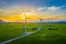 Landscape With Turbine Green Energy Electricity, Windmill For Electric Power Production, Wind Turbines Generating Electricity On Rice Field At Phan Rang, Ninh Thuan, Vietnam. Clean Energy Concept.