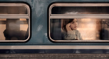  Young Asian Woman Looking Through The Train Window.