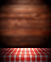 3d Empty Table Texture Covered With Red Checkered Tablecloth. Wooden Wall Dark Brown Defocus Background. Kitchen Interior. 