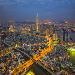 Wall Mural - Top view aerial photo from flying drone of a Ho Chi Minh City with development buildings, transportation, energy power infrastructure. Nguyen Huu Canh street.