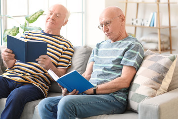 Poster - Elderly men reading books at home