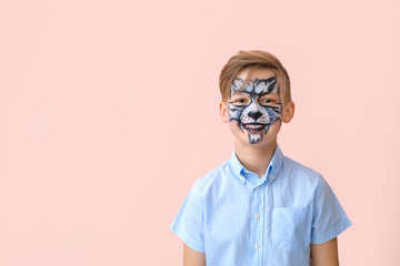 Poster - Funny little boy with face painting on color background