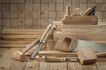 Wall Mural - set of carpentry tools wooden mallets chisels woodworking planner on wood background