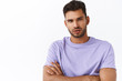 © Cookie Studio - Close-up shot passionate serious-looking macho man with bristle, wear purple t-shirt, squinting gazing camera, cross arms over chest, listening carefully to someone talking, white background