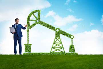 Businessman and green oil energy concept