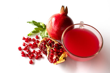 Wall Mural -  pomegranate with leaves and juice isolated on white background