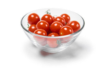 Wall Mural - cherry tomatoes in a glass bowl, isolated on a white background