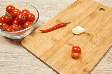 Wall Mural - still life with cherry tomatoes, chili pepper and garlic