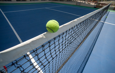 The tennis ball is suspended on the head band.