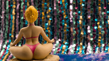 The Little Statuette Of Women Doing Yoga.  Lotus Position
