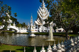 Fototapeta Sawanna - A beautiful view of white temple at Chiang Rai, Thailand.