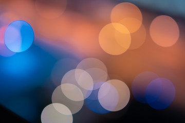 Bokeh lights, city streets at night, pink and blue, used as a background Shot with lens blur