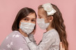 © Stanislaw Mikulski - Coronavirus and air pollution concept. Little girl with mom in protective masks