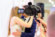 Cameraman recording video of a wedding