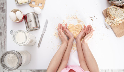 The view from the top. Mom and daughter prepare pastries in the kitchen.