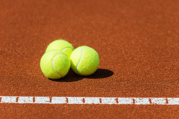 Tennis balls on a tennis court.Shallow doff