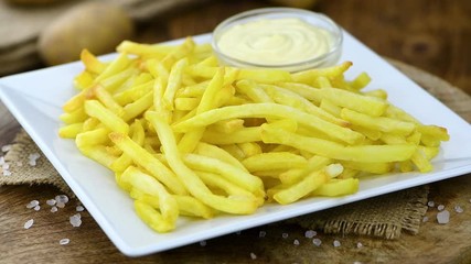 Wall Mural - French Fries on a rotating plate (seamless loopable)