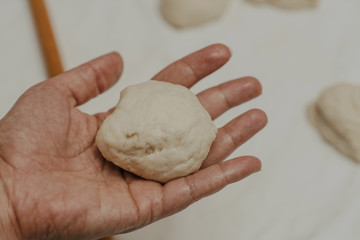 Muslim woman in isolation making bread for meal during holy month Ramadan