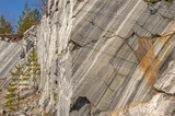 Fototapeta Desenie - Material surface, stone in the cut, rock background, large marble texture, marble quarry, ancient rocks