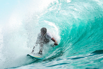 Wall Mural - man surfing in sea