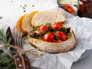 Baked сamembert with tomatoes and bread