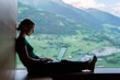 © BullRun - Skilled Caucasian female IT professional checking notification for laptop system connected to 4g internet, woman freelancer doing remote teleworking for banking via netbook app during vacations