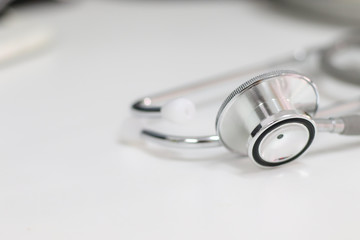 Stethoscope isolated equipment on white texture with blurred background