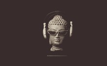 Close-up Of Buddha Statue With Sunglasses And Headphones