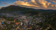 panorama of the city and sunset in the mountains including twilight sky