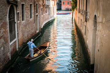 Wall Mural - Man on a boat in Venice