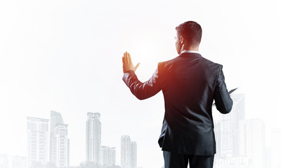 Back view of man in business suit and tie