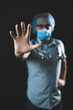 © astrosystem - Medical doctor, nurse, surgeon, psychologist working with protective mask, glasses and gloves helping people in the days of panic, pandemic - studio shot on black background.