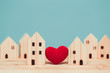 © Quality Stock Arts - Love heart between two house wood model for stay at home for healthy community together concept.