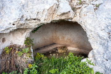 Wall Mural - Prehistoric tombs in the Unesco site of Pantalica. Necropolis of Pantalica, Sortino, Syracuse, Sicily, Italy.