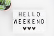 white lightbox with the words hello weekend.  Inspirational Quote