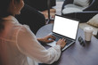 © panitan - computer mockup image blank screen with white background for advertising text,hand woman using laptop contact business search information on desk at coffee shop.marketing and creative design