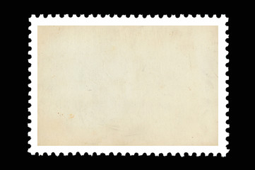 Vintage blank postage stamp on a black background