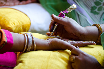 Canvas Print - applying henna on hand, Hindu wedding , Rajasthan, India	