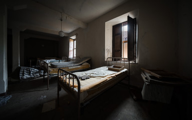 Wall Mural - Dark and scary bedroom of an abandoned house