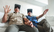 © DisobeyArt - Senior mature couple having fun with virtual reality glasses - Old people using new headset goggles trends technology - Joyful elderly lifestyle concept - Focus on center hands