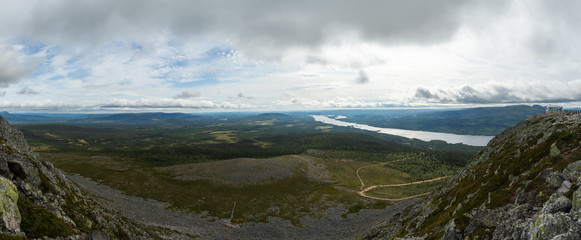 Wall Mural - panoramic overview over a valley with forest and lakes in sweden on a cloudy day