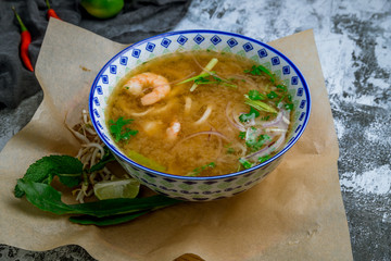 Wall Mural - Vietnamese soup Pho with shrimp and squid. PHO TOM Vietnamese cuisine