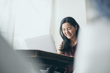 work from home.using computer.hand typing keyboard laptop online chatting search form internet while working sitting on sofa.concept for technology device contact communication business people