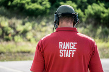 A Range Safety Officer Walks On A Gun Range During A Police Firearms Training Day.