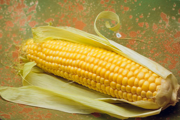 Wall Mural - Boiled corn with tops. Yellow agriculture organic vegetarian fresh summer food close up.