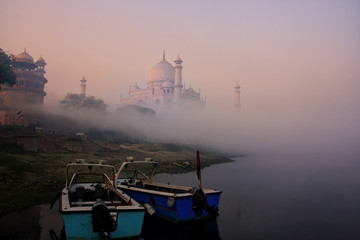 Wall Mural - Boats anchored on Yamuna River near Taj Mahal in early morning, Agra, Uttar Pradesh, India