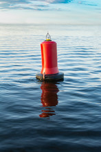 Warning Red Buoy In The Ocean