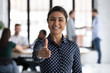 Smiling young Indian businesswoman look at camera stretch hand welcome new employee at workplace, happy biracial female recruiter meeting greeting newcomer newbie in office, employment concept