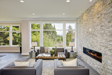 Wall Mural - Modern great room with a floor to ceiling stone fireplace. Luxury American modern home.