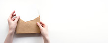 Envelope And White Empty Letter Mock-up In Female Hands Top View With Copy Space. Communication, Information, Post, Mail Concept. Web, Social Media Banner Template. Stock Photo.